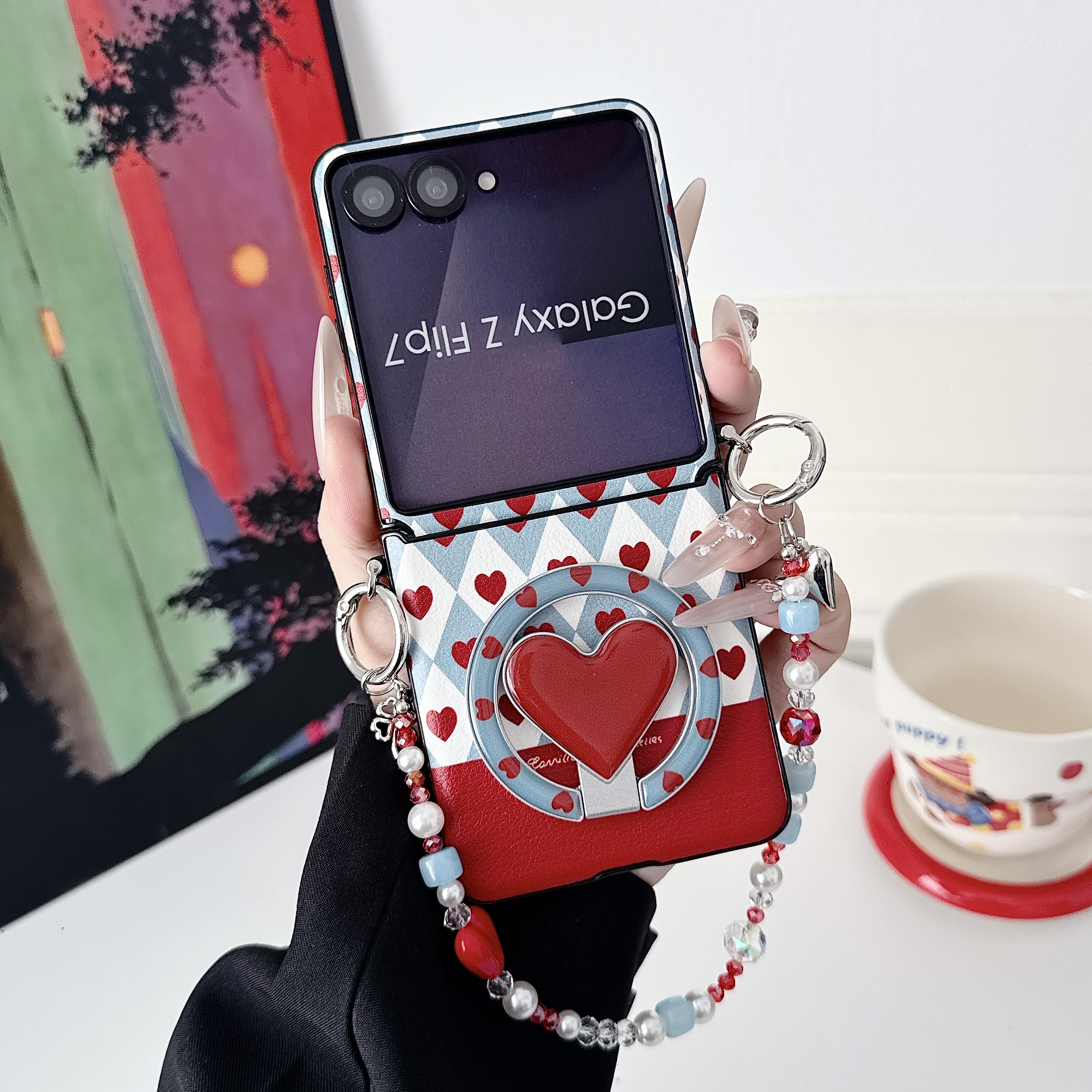 Samsung Galaxy Z Flip 7 slim phone case, featuring a detachable magnetic heart-shaped stand and a beaded hand strap. - Image 4
